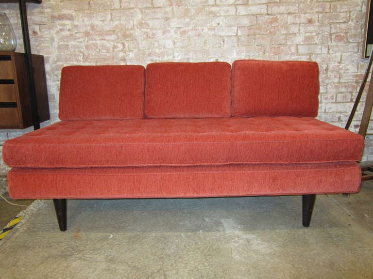 Dunbar armless sofa. Burnt orange velour upholstery.