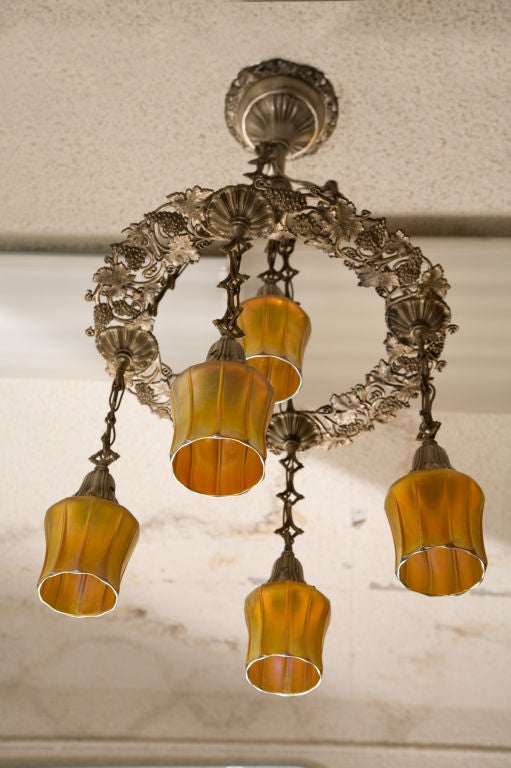 Very unusual and well conceived silvered bronze five-arm ring style chandelier.  This fixture exemplifies the best possible detail in casting.  The grapes are so crisp and well defined, you know the maker took great pride in his craft.  Note that
