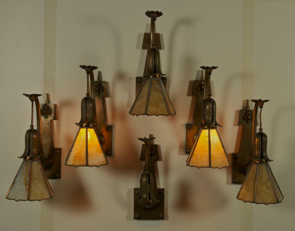 These very special sconces are a very high quality cast bronze and have their original slag glass panel shades.  Purchased out of a house in Portland, they are being offered for the first time.  The one sconce that we have pictured without the shade