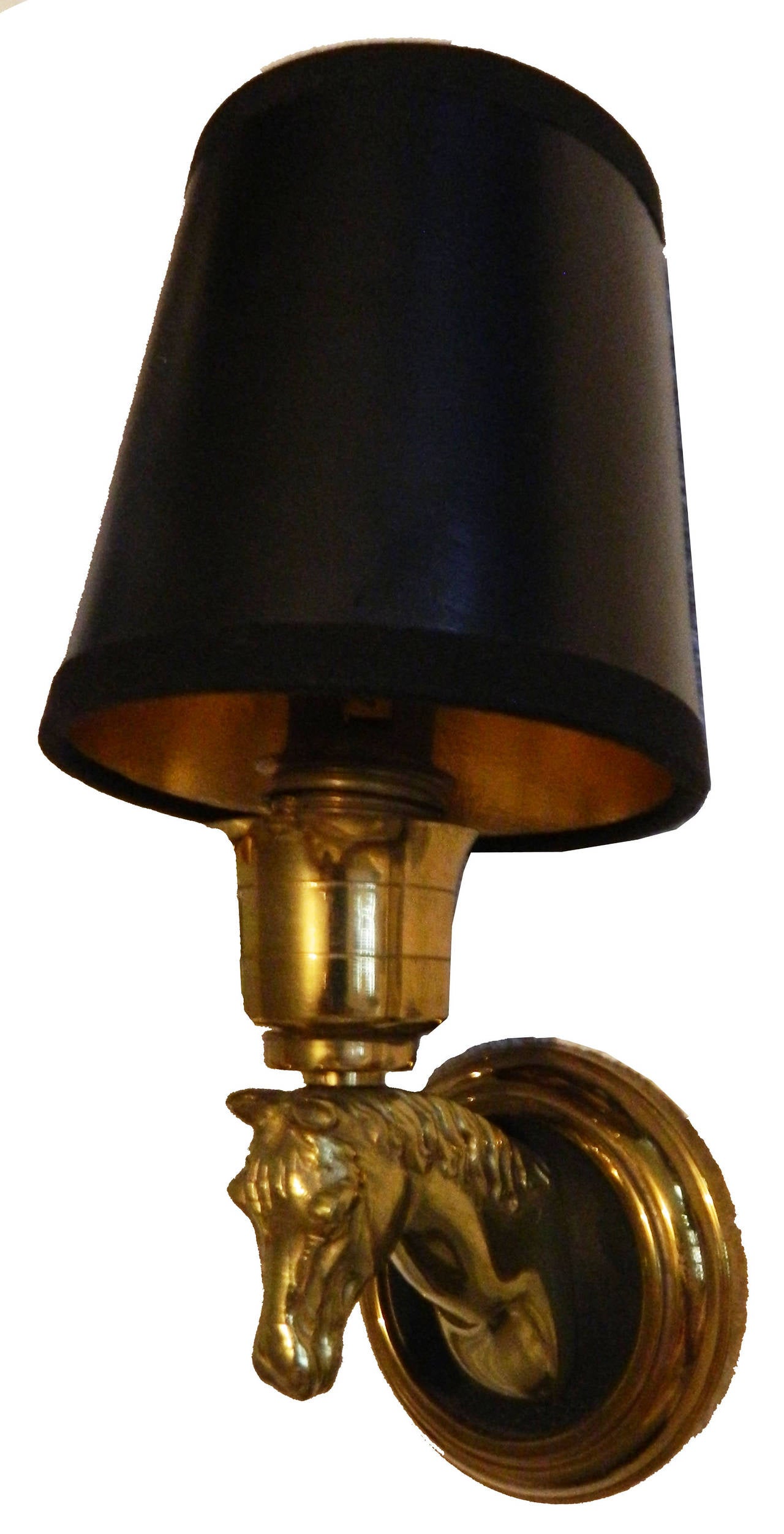 Fantastic set of three pairs of French brass horse sconces, two patina brass and black lacquer brass. Priced by pair.
US rewired and in working condition.
Backplate diameter: 3 1/8 inches.
One bulb, 40 watts max.
Priced by pair.
Have a look on