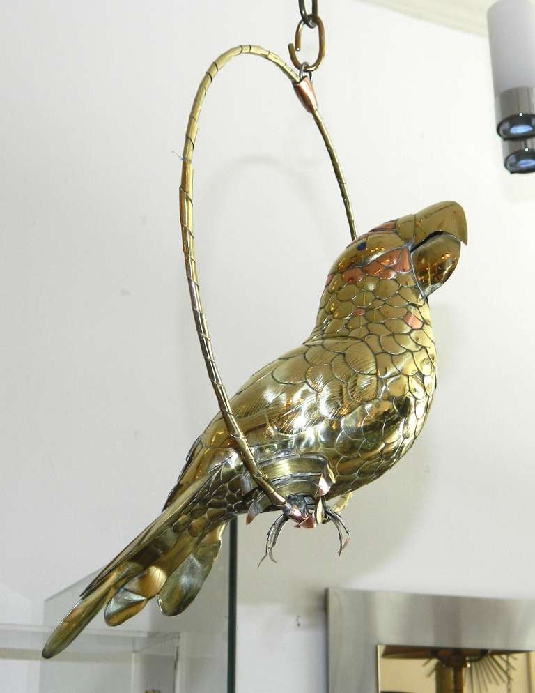 Brass and copper Parrot on his wing  by Sergio Bustamante.
Have a look on our large collection of Parrots...
