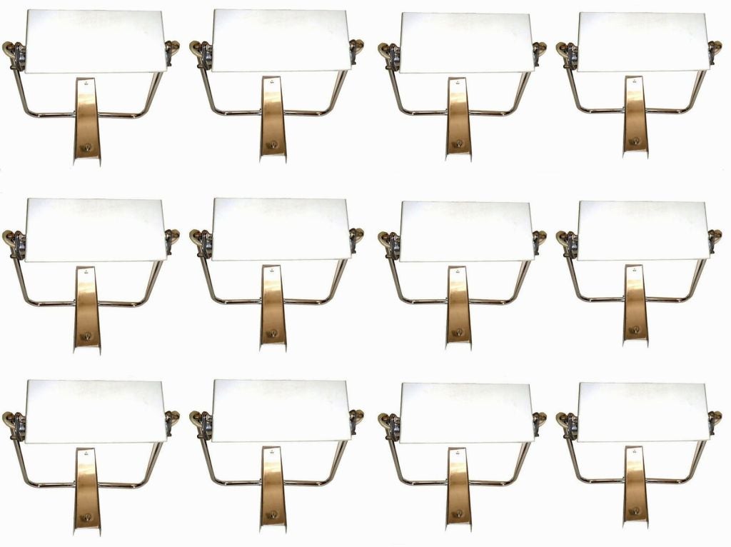 12 signed Fontana Arte sconces, designed by Livio Castiglioni.
Model AT / 1P.
Priced by pair.
Chrome and mat grey aluminum,
Italy, 1972.
US wired and in working condition.
Have a look on our largest collection of French and Italian Mid-Century