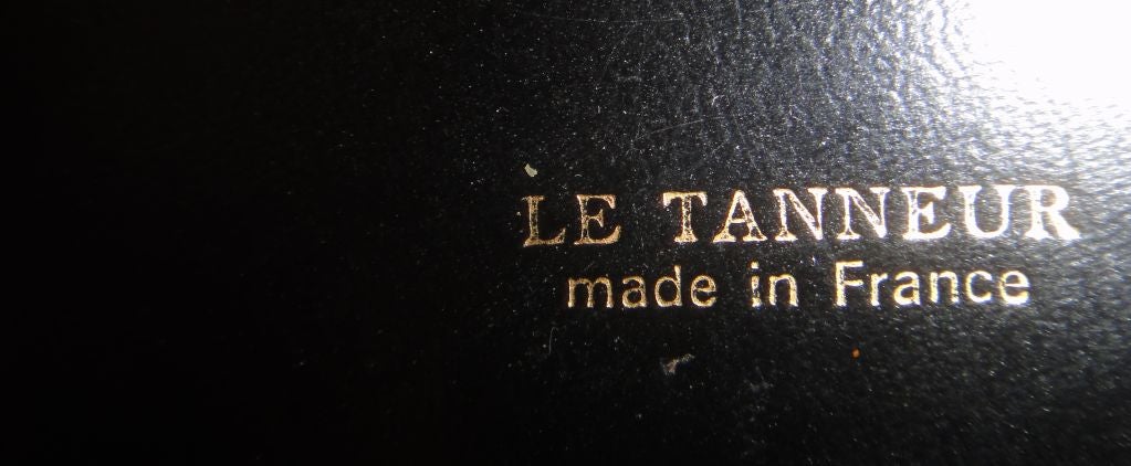 Pair of Table Lamps from Paris made out of Brass and Leather signed at the Base  'Le Tanneur' made in France. 
US rewiring and each takes a max 75 watts light bulb.