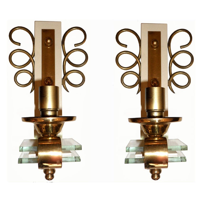 Original pair of 1950 sconces, wall lights, lamps made out of brass and crystal.
US Rewiring and each takes a max. 40 watts light bulb.
3 pairs available. Priced by pair.
Have a look on our impressive collection of French and Italian Mid-Century