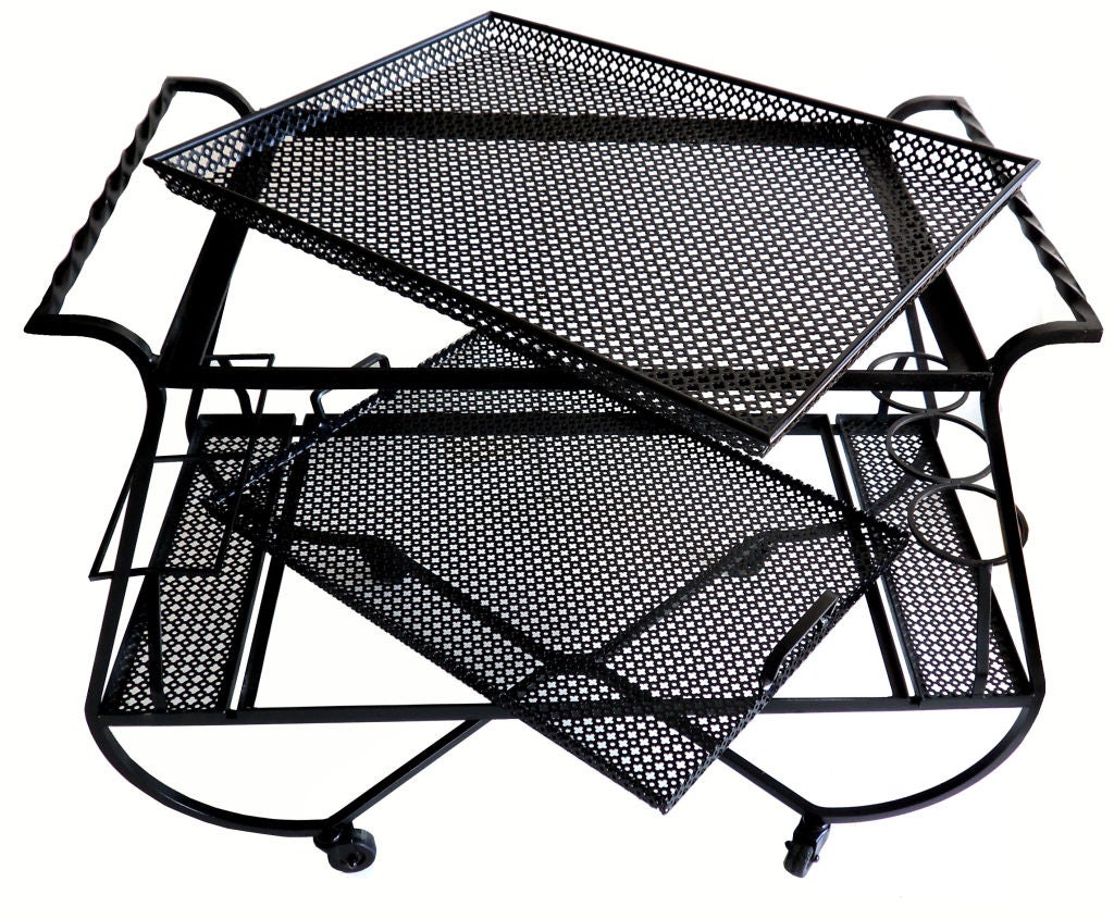 Bar cart by Mathieu Mategot made in Rigitulle (perforated metal design). Pictured in the Mategot book; image 7 and image
Curved and twisted frame paint in black, two removable trays
Pictured in The Mategot book by Jousse edition
The top of each
