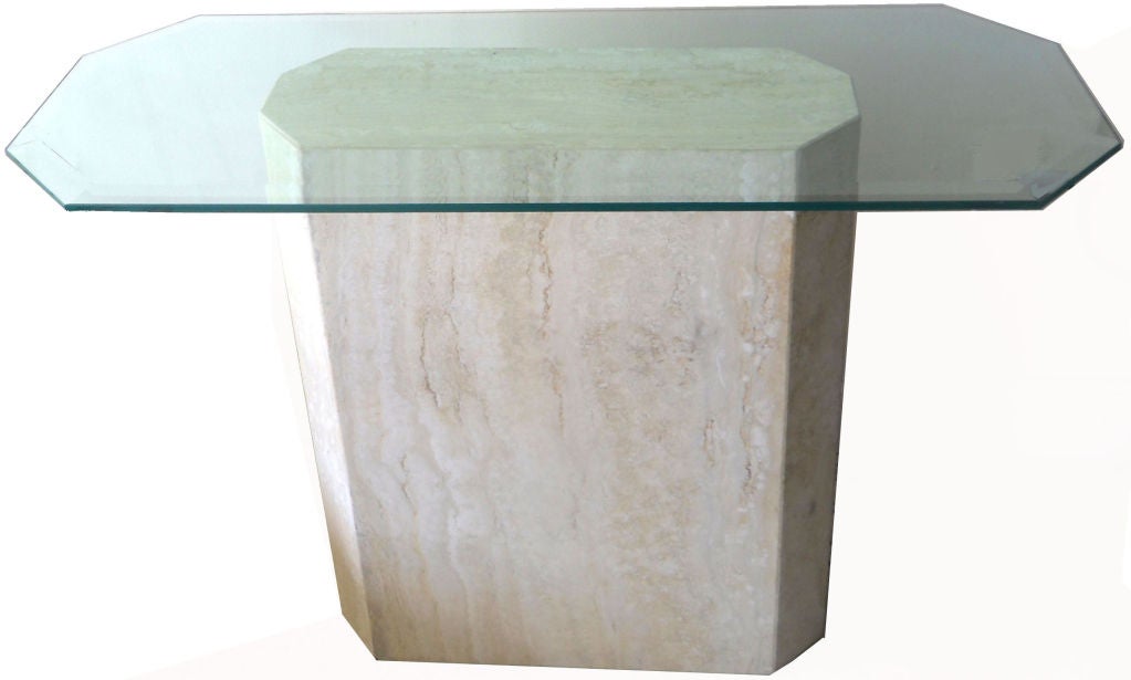 Very  elegant and stable Italian Console on a heavy Travertine base. 
Thick Beveled glass top (can be exchange for a larger one). 
Can be used as a center gueridon.

The tables lamps are not included in the price !

Pictured with a Travertine table