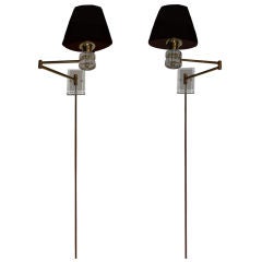 Pair of retractable lucite and brass wall sconces