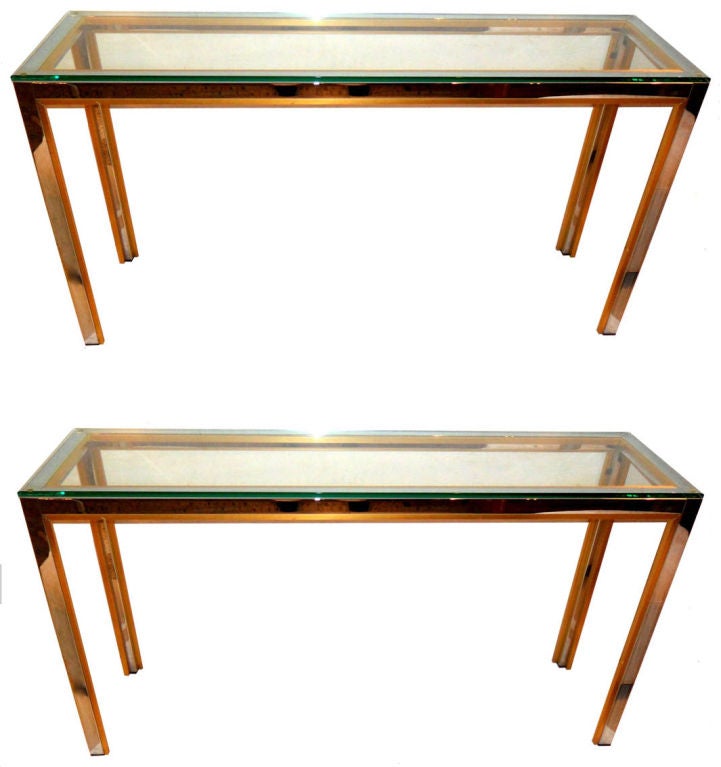 Mid-Century Modern Pair of long consoles by Zilli Italy in the 1970.
Made out of Chrome with Brass Inlay and Tops are made out of thick clear Glass.
Great for the Hallway or as Sofa Tables.