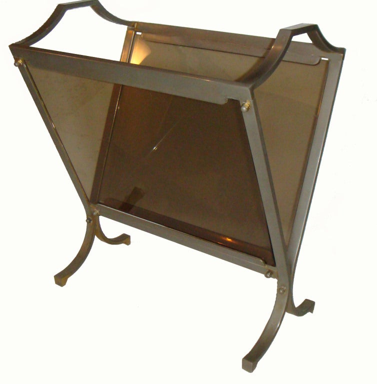 Solid and heavy polished steel French magazine rack by Maison Jansen.