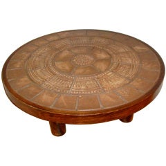Round coffee table by Roger CAPRON