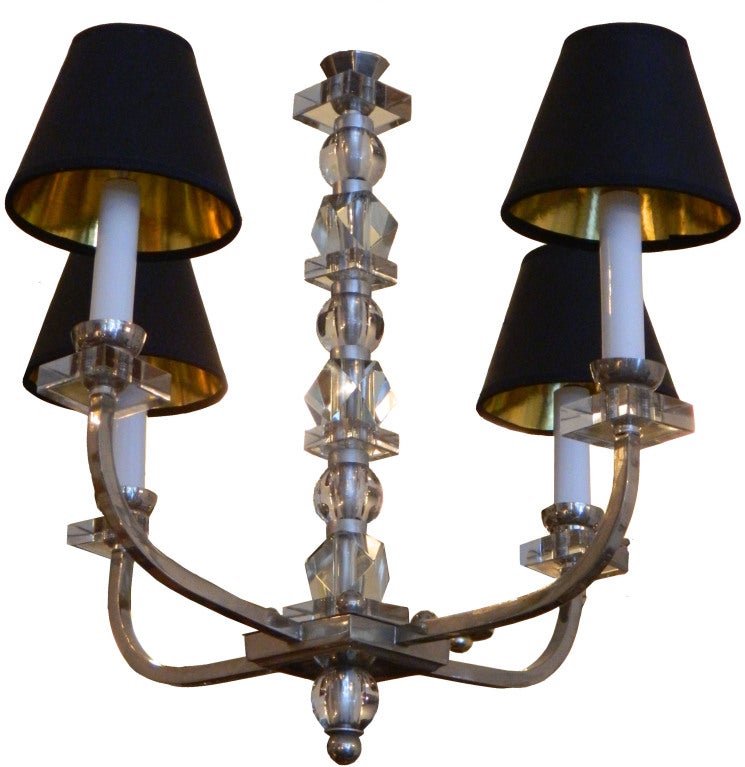Four lights nickeled-plated over brass chandelier in the style of Jacques Adnet.
US wired and in working condition, takes 4 light bulbs with max. 60 watts.
Shades are not included.