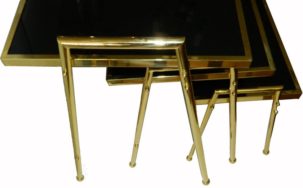 Three very elegant French black glass tops nesting tables designed by Maison Jansen.
Measurements: 1) 20