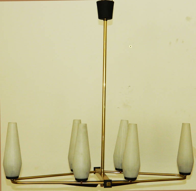 Mid-Century Modern Stilnovo style six lights chandelier with the original blown Opaline glass shades, made in Italy circa 1960. 
2 patinas brass, polished brass and gun metal.
US wired and in working condition takes 60 watts light bulbs.