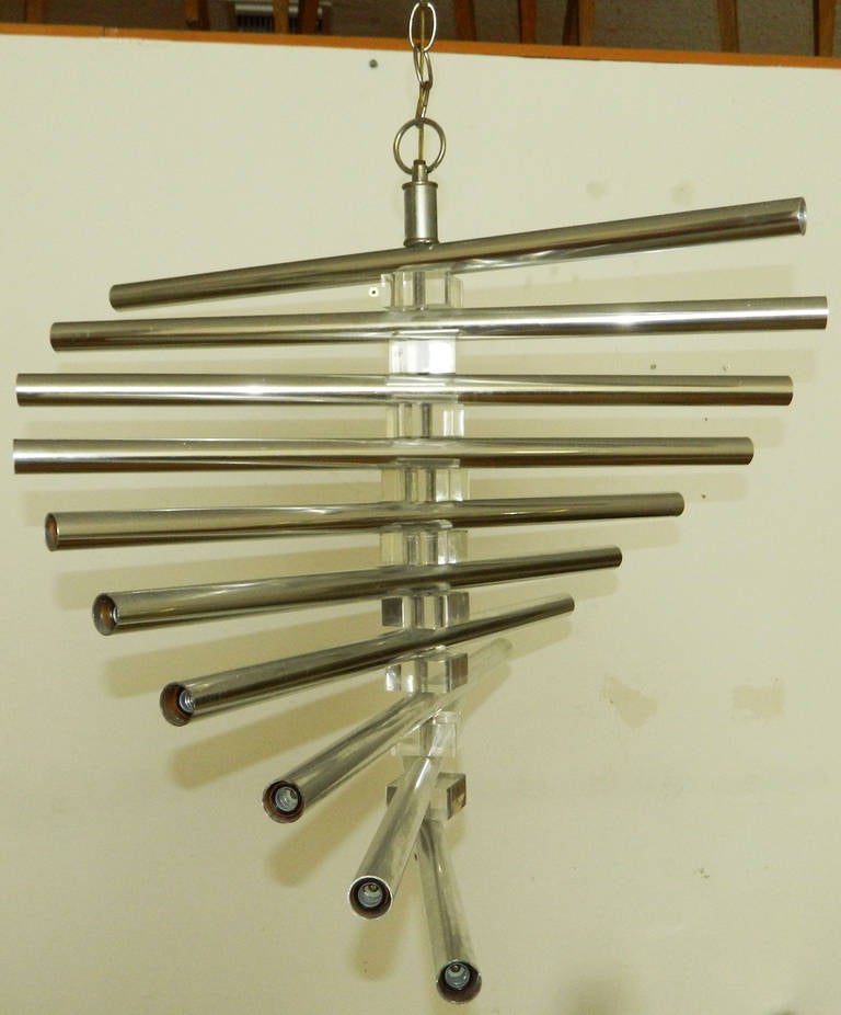 Italian chandelier in lucite and chrome. Ten tubes, 20 bulbs, adjustable form. US wired and in working condition.