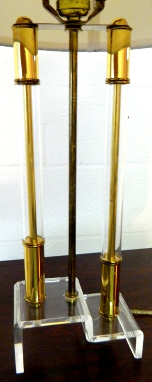 Delicate and elegant pair of lucite and brass table lamps. 0ne bulb 80W.
Base measurements: 7