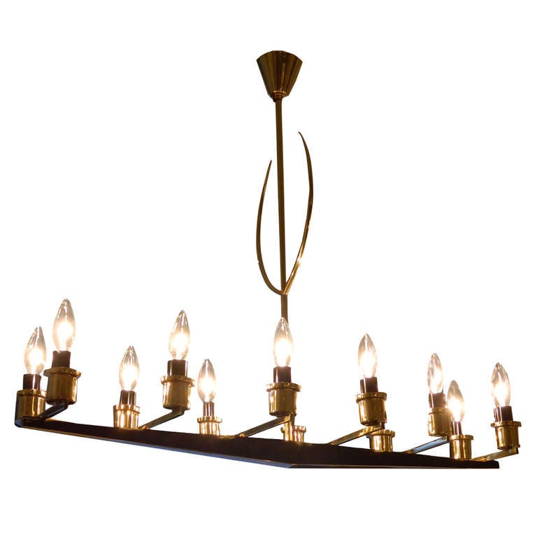 Very elegant 12 Light French Mid-Century Modern, made circa 1950 with two patinas brass. 
Designer Maison Arlus.
US rewiring and in working condition takes 12 light bulbs with max 60 watts.
Providence: 