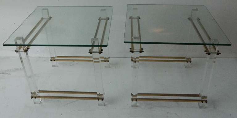 Pair of square Mid-Century Modern side table in Lucite & Brass base and each has a glass top.
