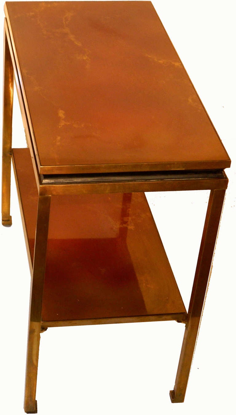 French 2 tier side table by  Guy LEFEVRE. polished brass frame.
Measurement from the floor to the bottom tier: 9