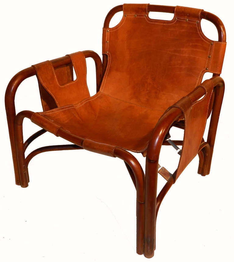 Fantastic and impressive pair of armchairs in the style of Arne Norell. Bamboo and leather.