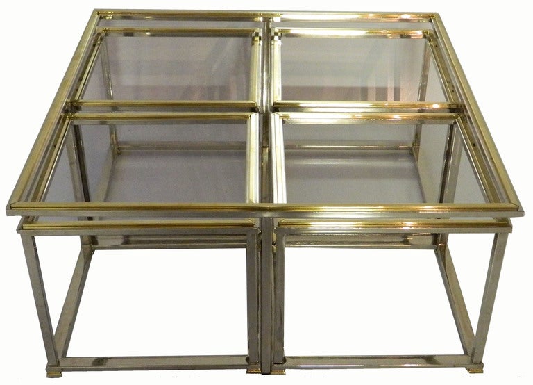 Huge square two-tier cocktail table with four small square.

Measurement of each small table: 19
