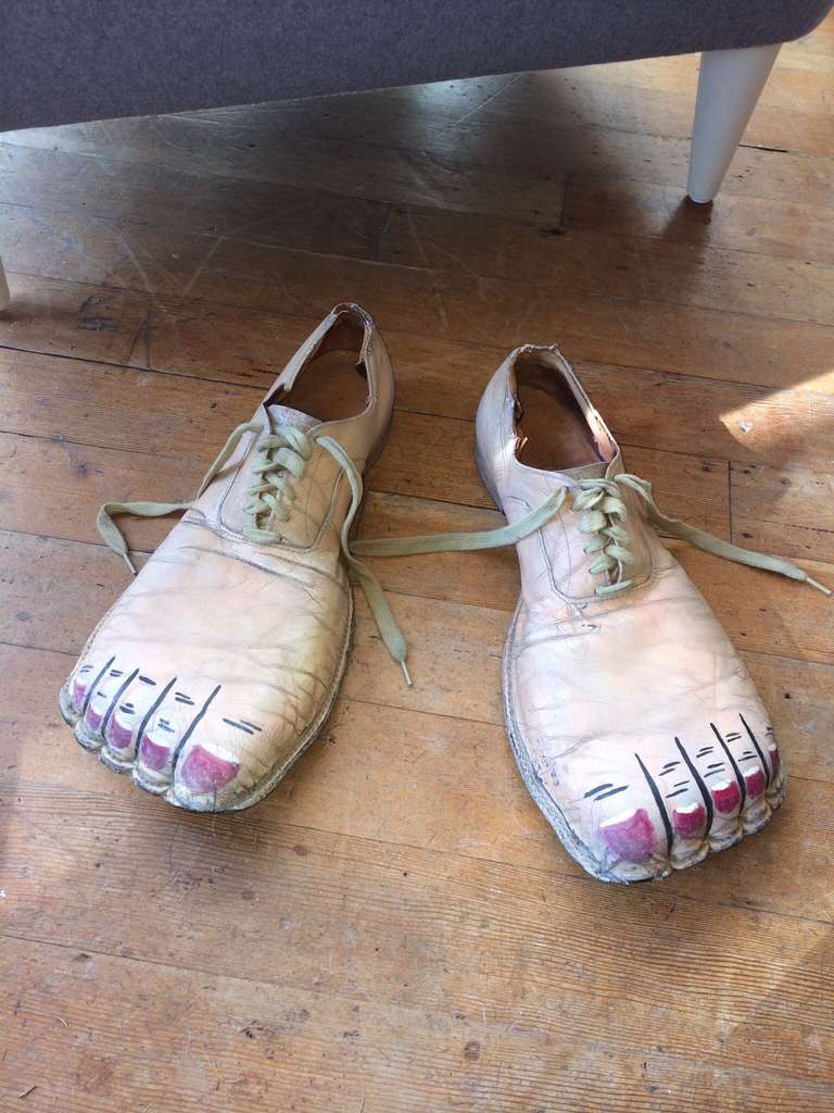 A playful pair of worn leather vintage clown shoes with Trompe-l'œil feet decoration