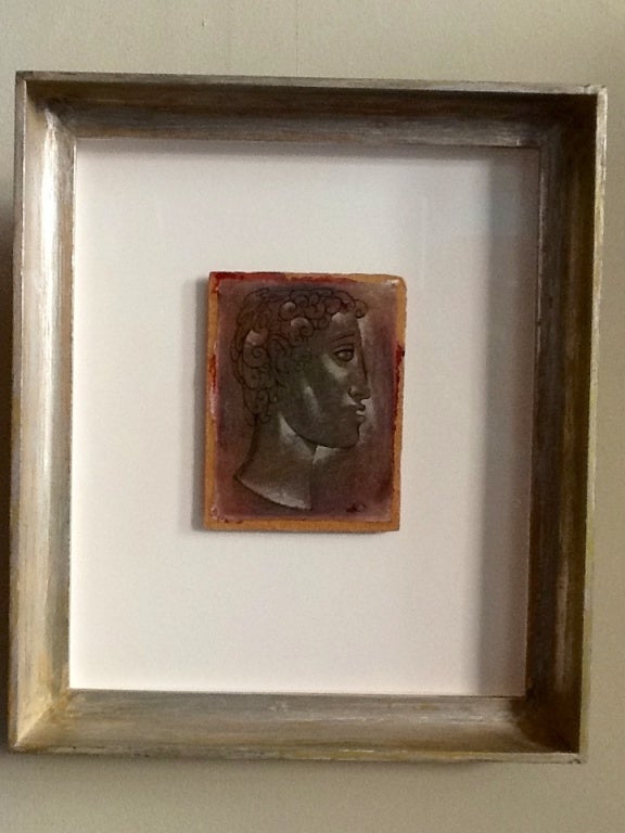 A small oil on Masonite profile portrait of a stylized man of antiquities by listed California artist Leon 