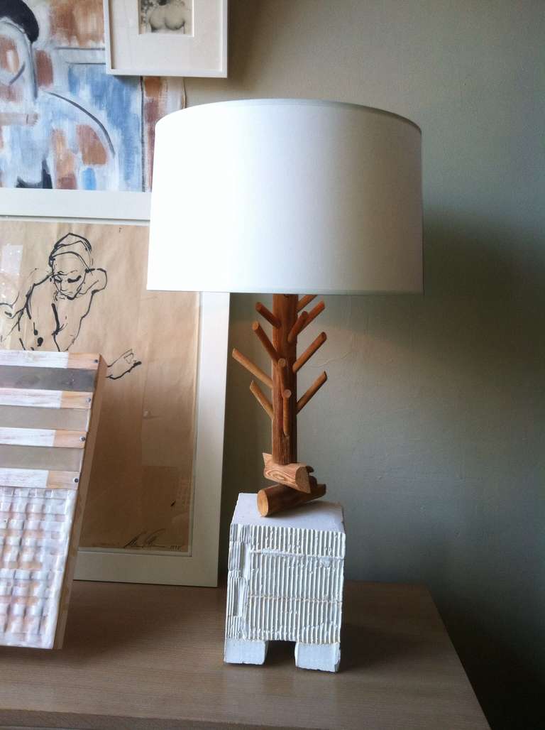 A quirky table lamp of formed plaster base and carved wood form of tree trunk. Unknown artist/designer, found in San Francisco. Shown with later paper shade not included