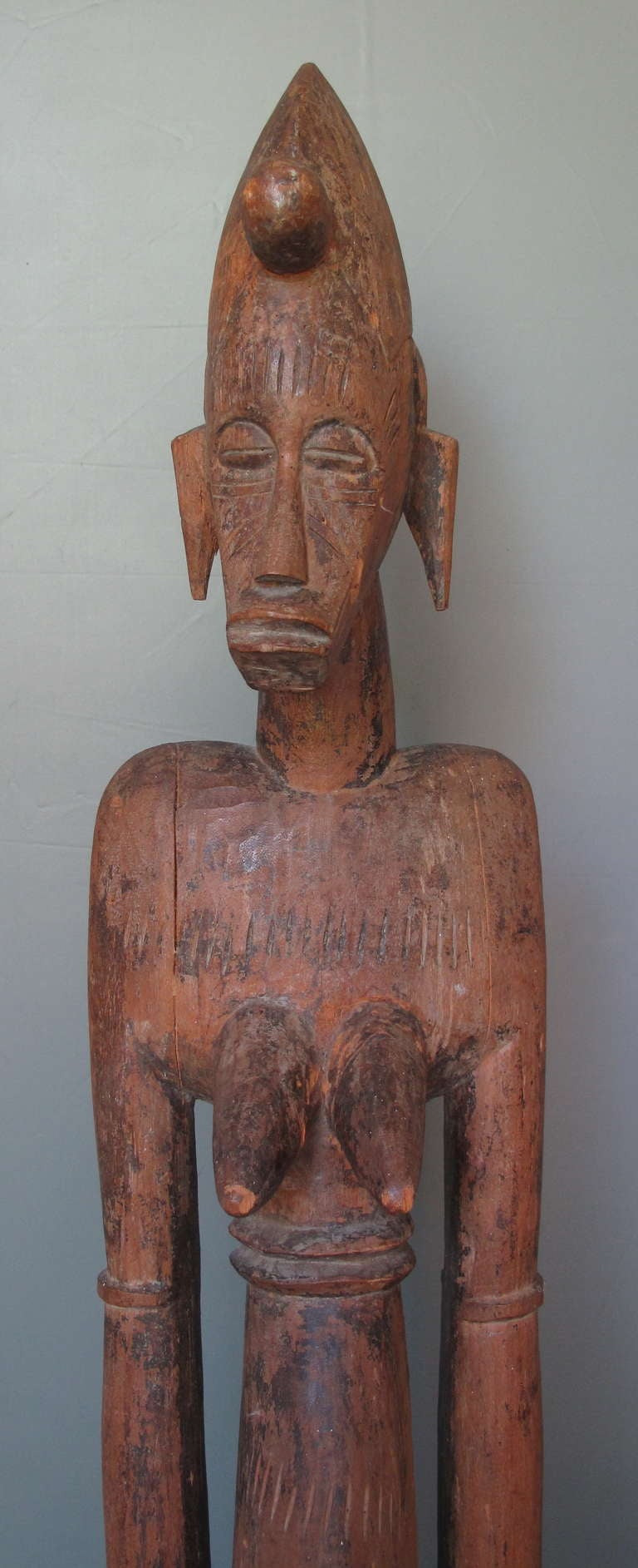 This female Senufo object, called deble, was used at Poro festivities, held by their upper arms and pounded on the ground to mark a rhythm for dancers.
The Senufo tribe spans several countries.