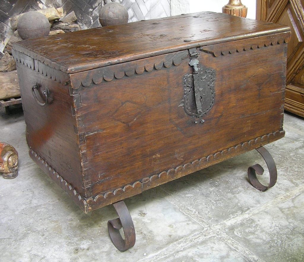 Mexican walnut trunk with a beautiful lock. 
The iron legs it sits on are 20th century and measure 9