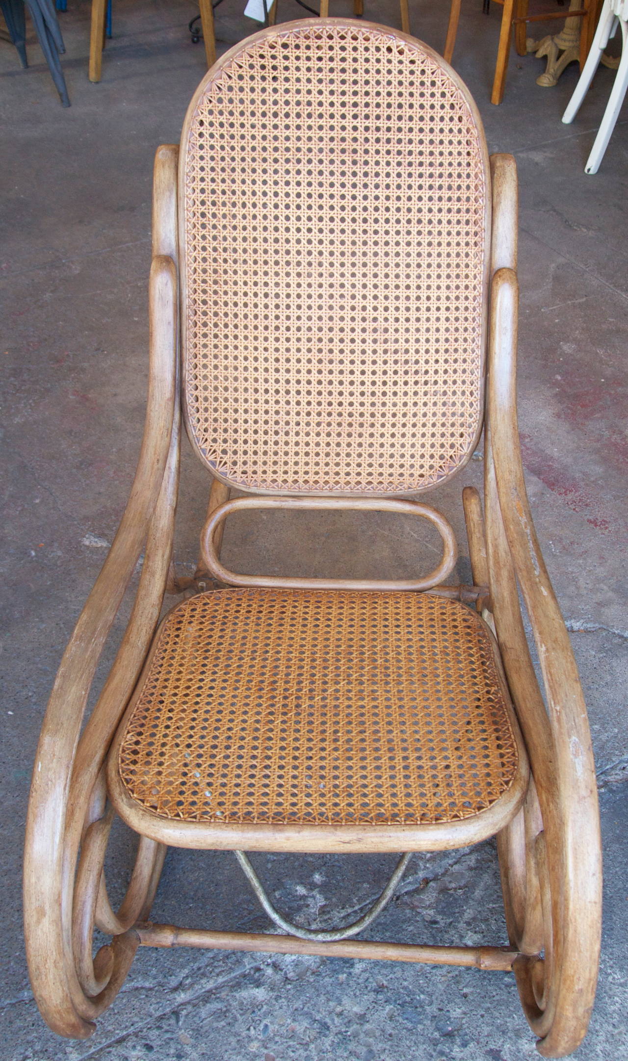 Rocking bentwood and caned chair by Thonet with original finish, circa 1900.