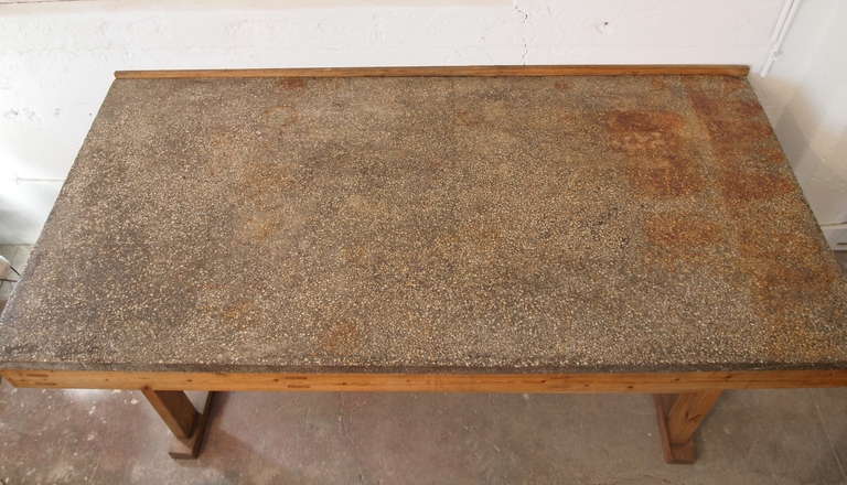 Useful and handsome French Industrial Work Table with a thick terrazzo concrete top and rustic pinewood base