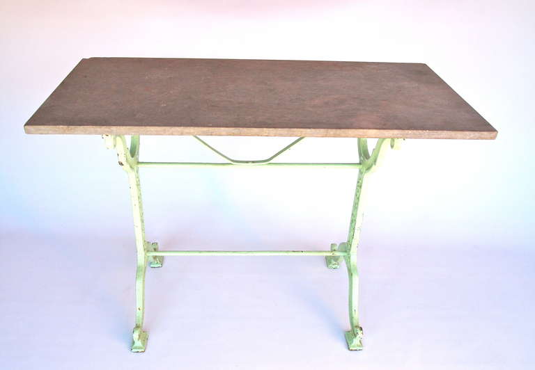 Thick grey marble top rectangular bistro table with light green painted cast iron base,  by Castagne & J. Charlionais, Toulouse