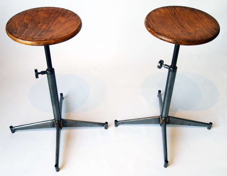 Pair of French Mid-20th Century adjustable height industrial stools.