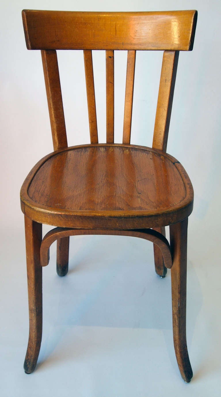 Set of 35 classic French wood bistro chairs from early 20th century, designed and manufactured by Baumann.
