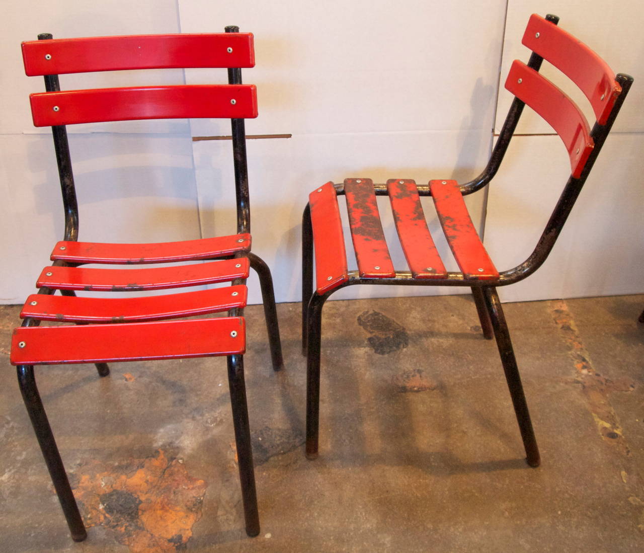 Set of 4 red and black painted French Industrial mid-century bistro side chairs with nice patina