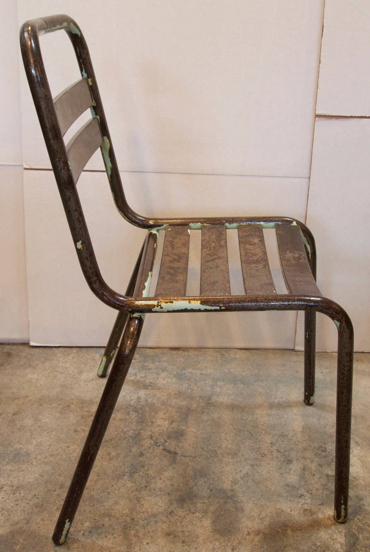 Pair of French Tolix stripped metal mid-century industrial side chairs with beautiful patina