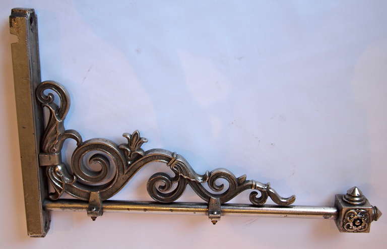 French horizontal wall mounted lantern bracket with decorative scroll work in nickel plated steel