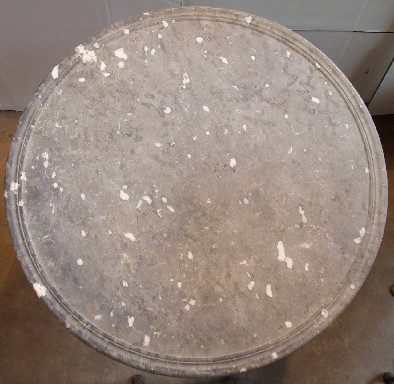 Wonderful French late 19th C. round grey marble top on a white painted cast iron base garden table