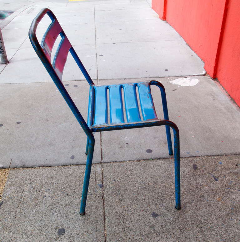 Set of 3 mid century industrial blue painted metal side chairs imported from France.