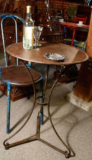 Elegant round top metal bistro table with very nice patina