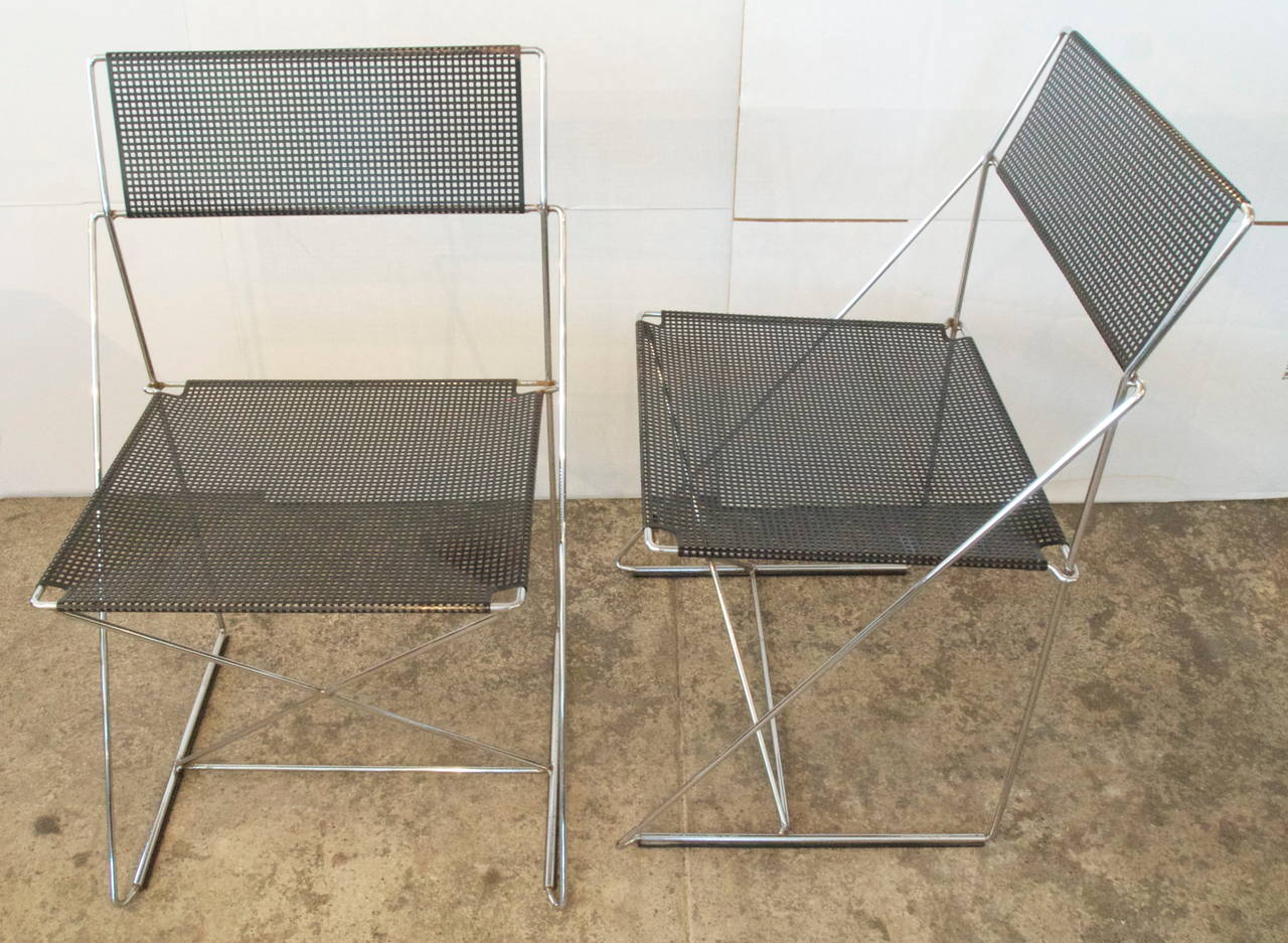 Pair of mid-century chrome and black enameled metal stacking side chairs designed by Neils Joergen Haugesen,   for the X- line by Magis,  made in Italy c.1977