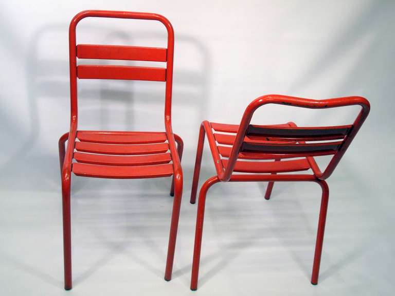 Set of 8 French red painted metal chairs