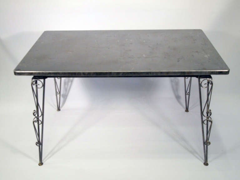 French mid-20th century metal table model Tolix 55 with twisted metal feet