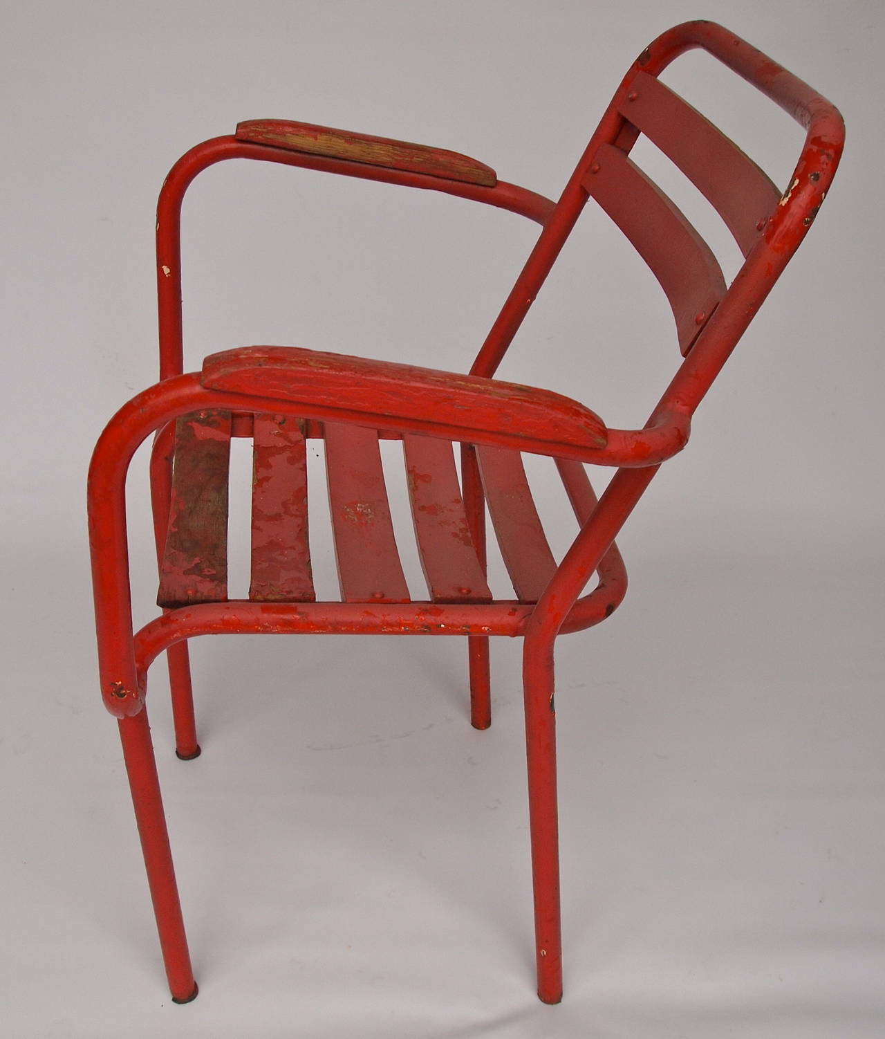 Set of 12 red painted metal and wood mid century stack-able garden or bistro armchairs 
Early 20th C. 
France