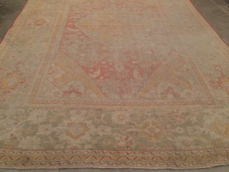Antique Oushak Rug In Distressed Condition For Sale In West Hollywood, CA