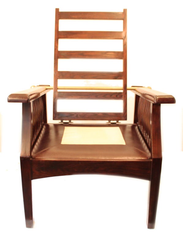 Very nice pair of Morris style recliner chairs with dark brown back and seats leather cushions.