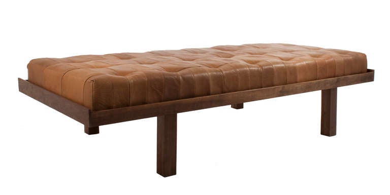 Leather and mahogany Bench.