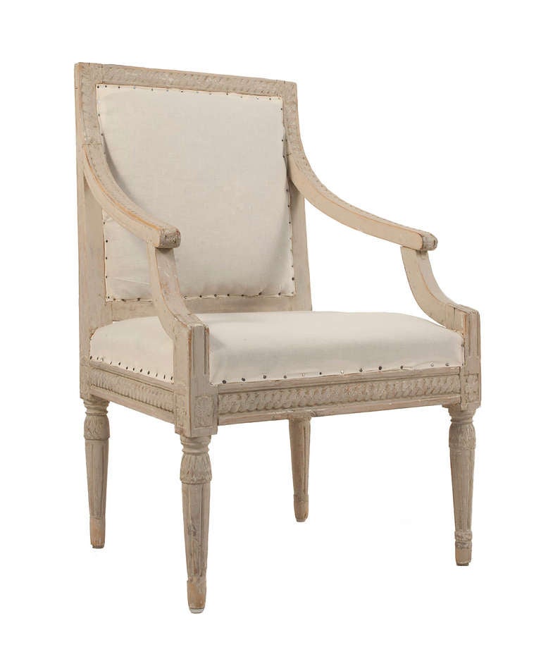 Pair of Gustavian Armchairs in a worn pale grey patina.