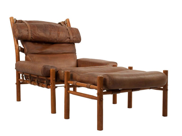 Pair of Lounge Chairs with Stools by Arne Norell in leather.