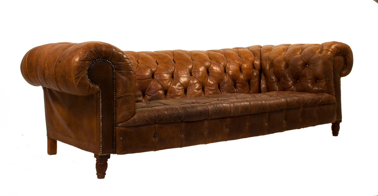Tufted leather Chesterfield sofa.
